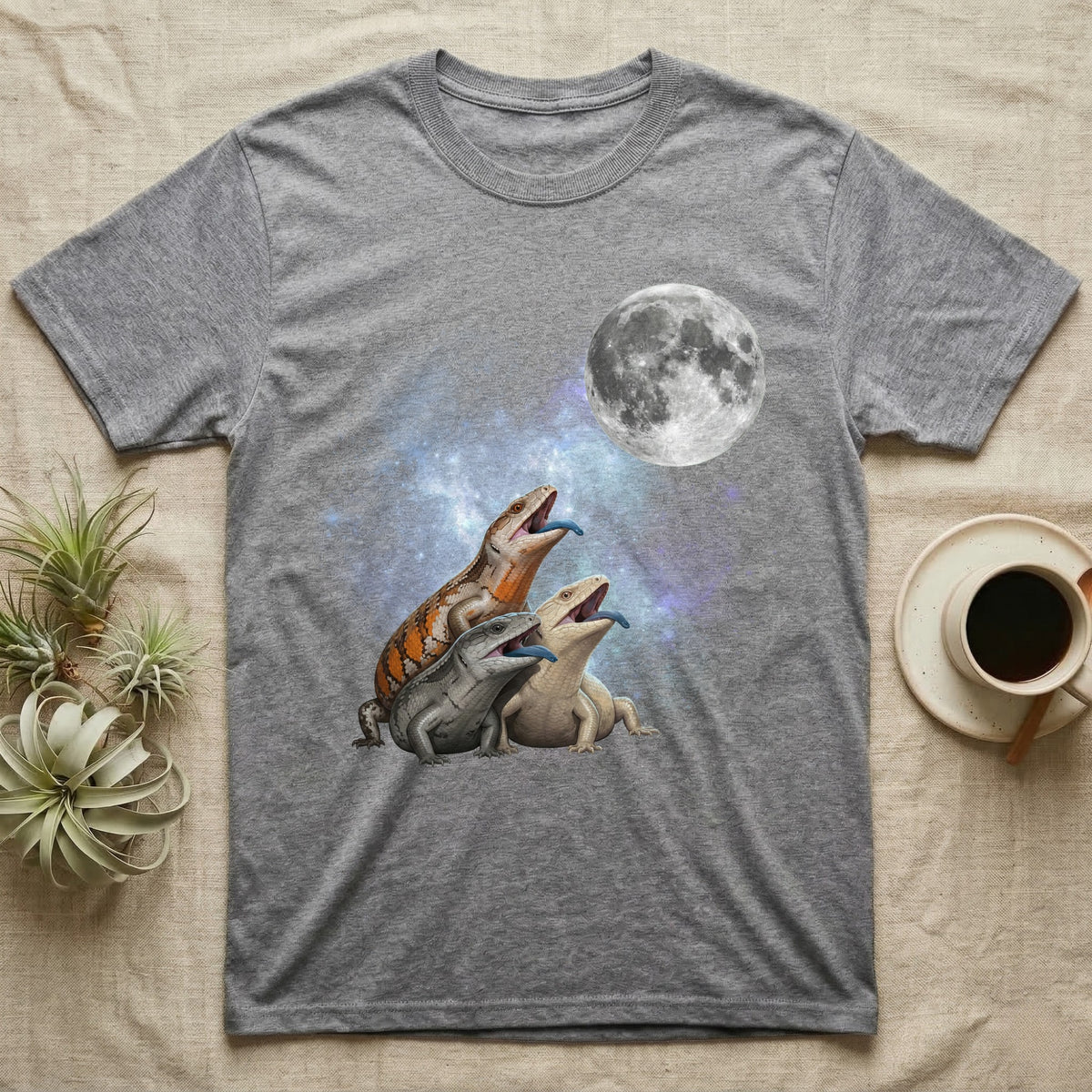 Blue-Tongued Skink Moon Howl T-Shirt in Sport Grey — Three Blue-Tongued Skink colour morphs howling at a full moon over a nebula on a dark grey t-shirt.