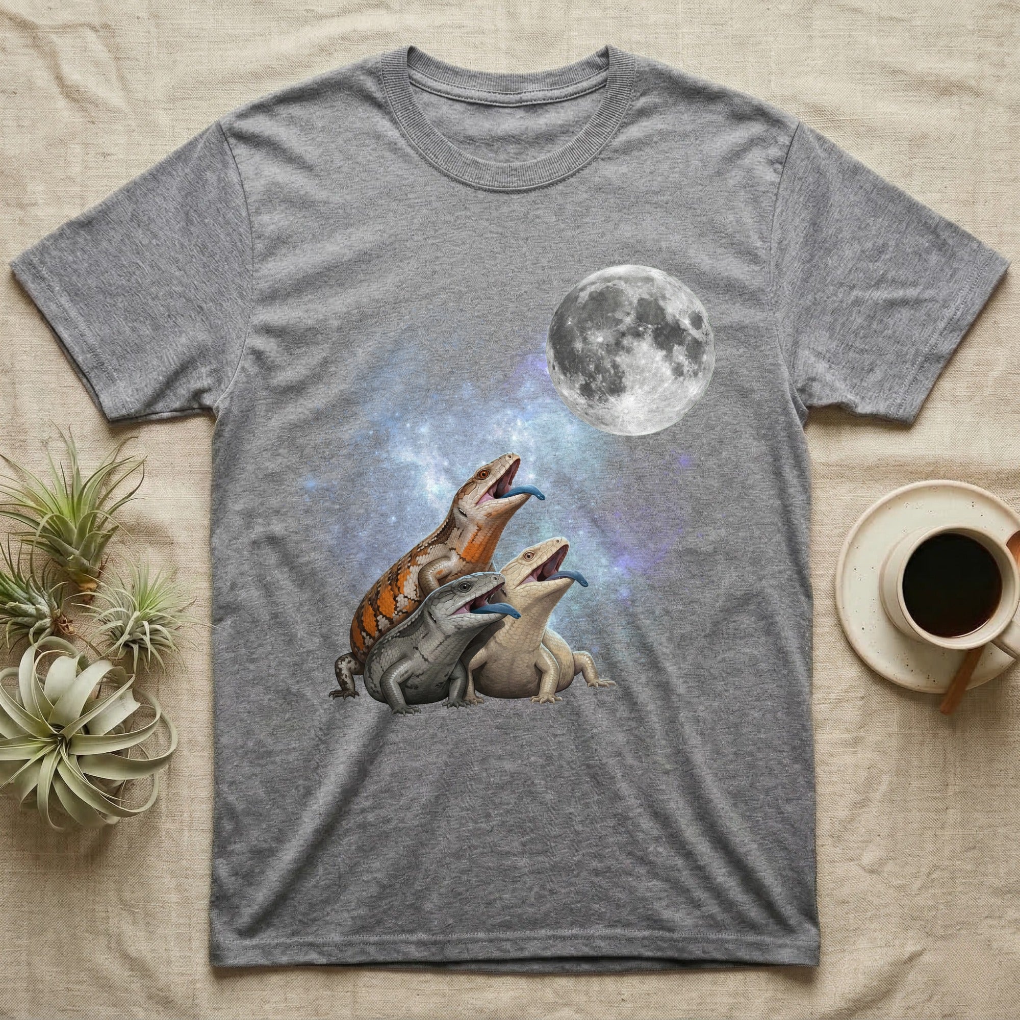 Blue-Tongued Skink Moon Howl T-Shirt in Sport Grey — Three Blue-Tongued Skink colour morphs howling at a full moon over a nebula on a dark grey t-shirt.
