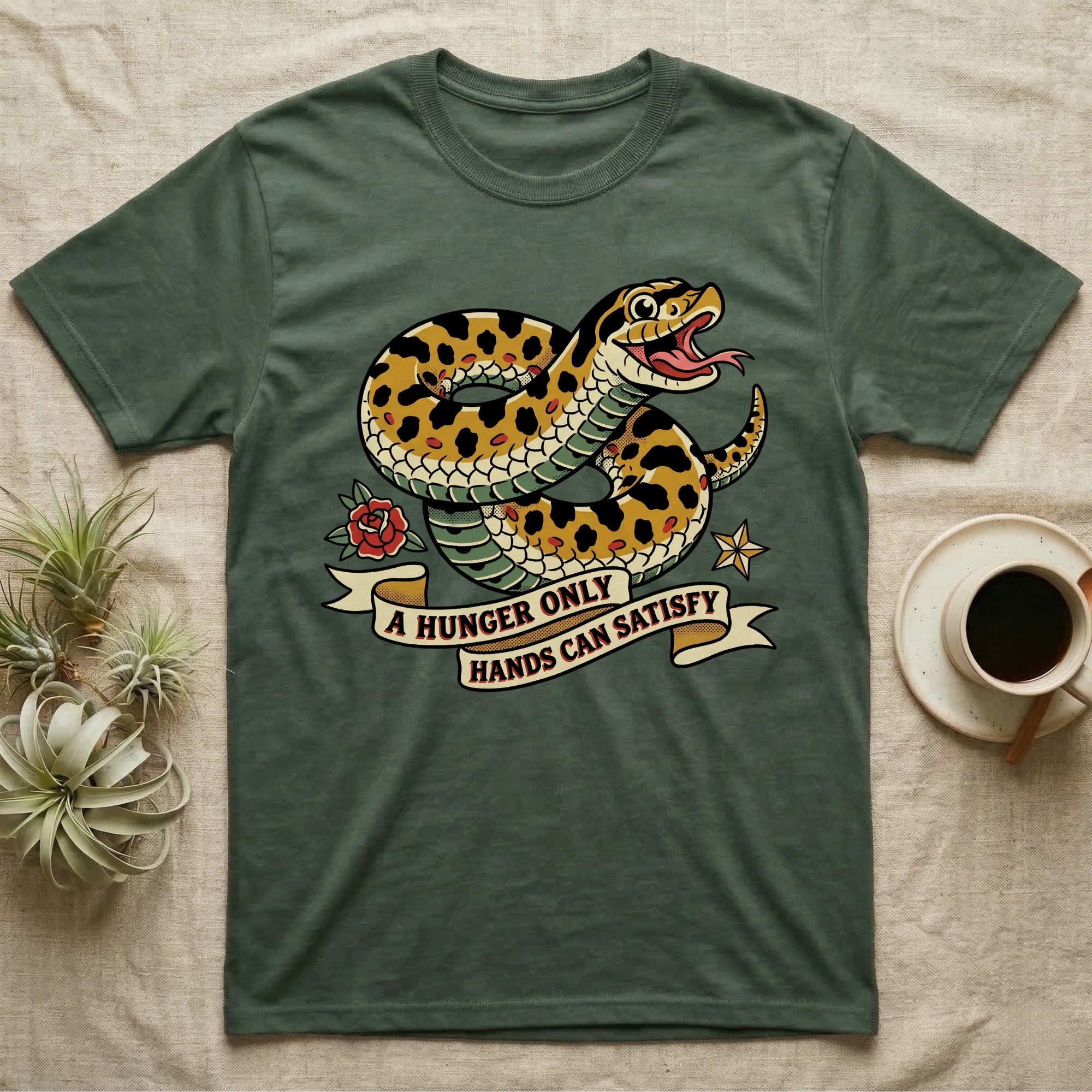 Hognose Hunger Flash T-Shirt in Military Green — American-traditional tattoo-flash illustration of a hognose snake in a heroic coil with a banner reading the feeding-hunger line.