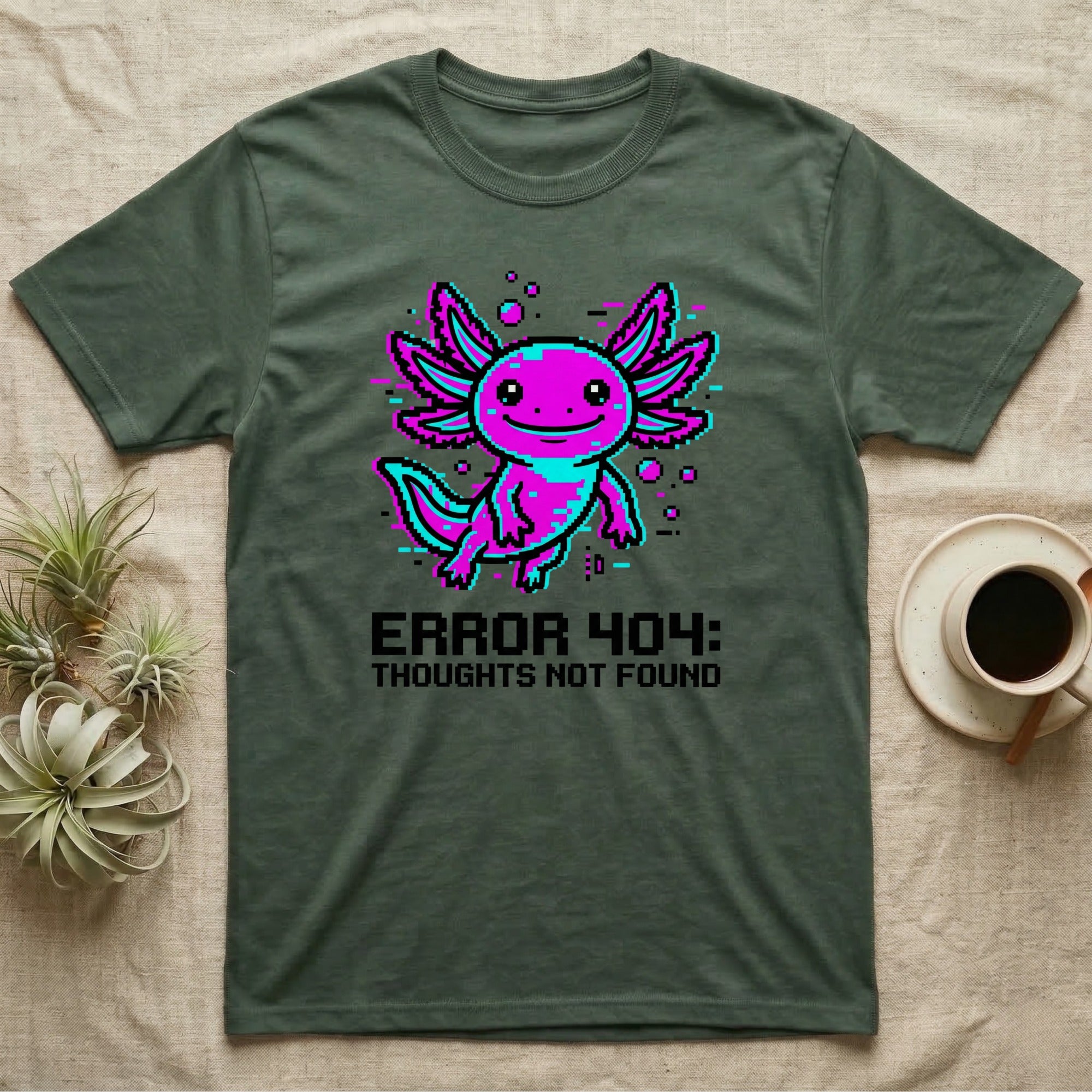 Green t-shirt with pixelated axolotl and "ERROR 404: THOUGHTS NOT FOUND" text.