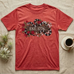 Kingsnake Floral 1776 T-Shirt in Heather Red — Black-and-white California kingsnake woven through roses and jasmine around a wooden sign reading Est. 1776.