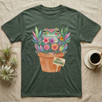 Tree Frog Thriving T-Shirt in Military Green — A White's tree frog made of watercolour flowers, sitting in a terracotta pot with a plant label reading STILL THRIVING.