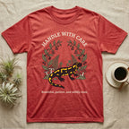 Fire Salamander Poison Plate T-Shirt in Heather Red — Naturalist apothecary-plate illustration of a fire salamander framed by a symmetric wreath of woodland botanicals.