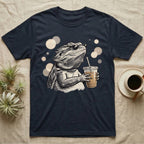 Cold Brew Bearded Dragon T-Shirt in Navy — Flat near-photoreal illustration of a bearded dragon in tiny sunglasses holding a cold brew with warm bokeh.