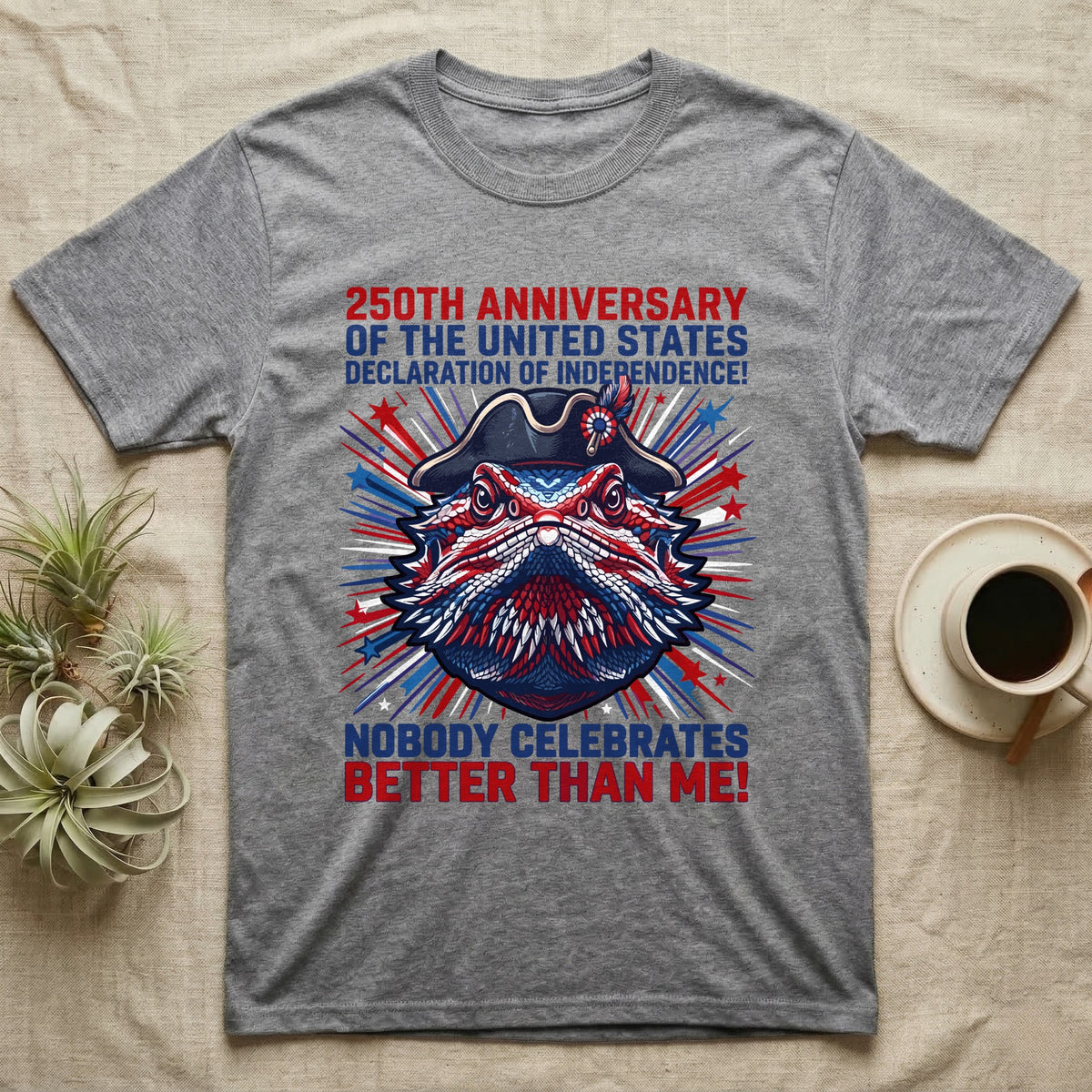 Bearded Dragon Fireworks T-Shirt in Sport Grey — Pop-art bearded dragon head in a tricorn hat amid red-white-blue fireworks under Nobody Celebrates Better Than Me.