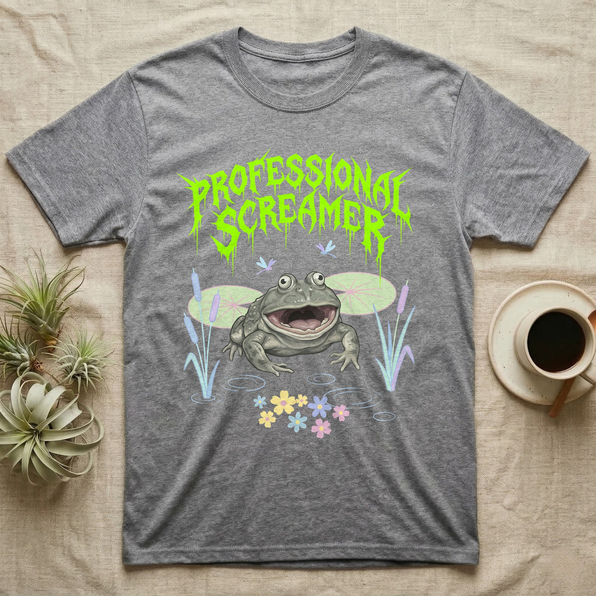 Budgett's Frog Feral T-Shirt in Sport Grey — Budgett's frog with wide screaming mouth under jagged acid-green metal text PROFESSIONAL SCREAMER with lily pads