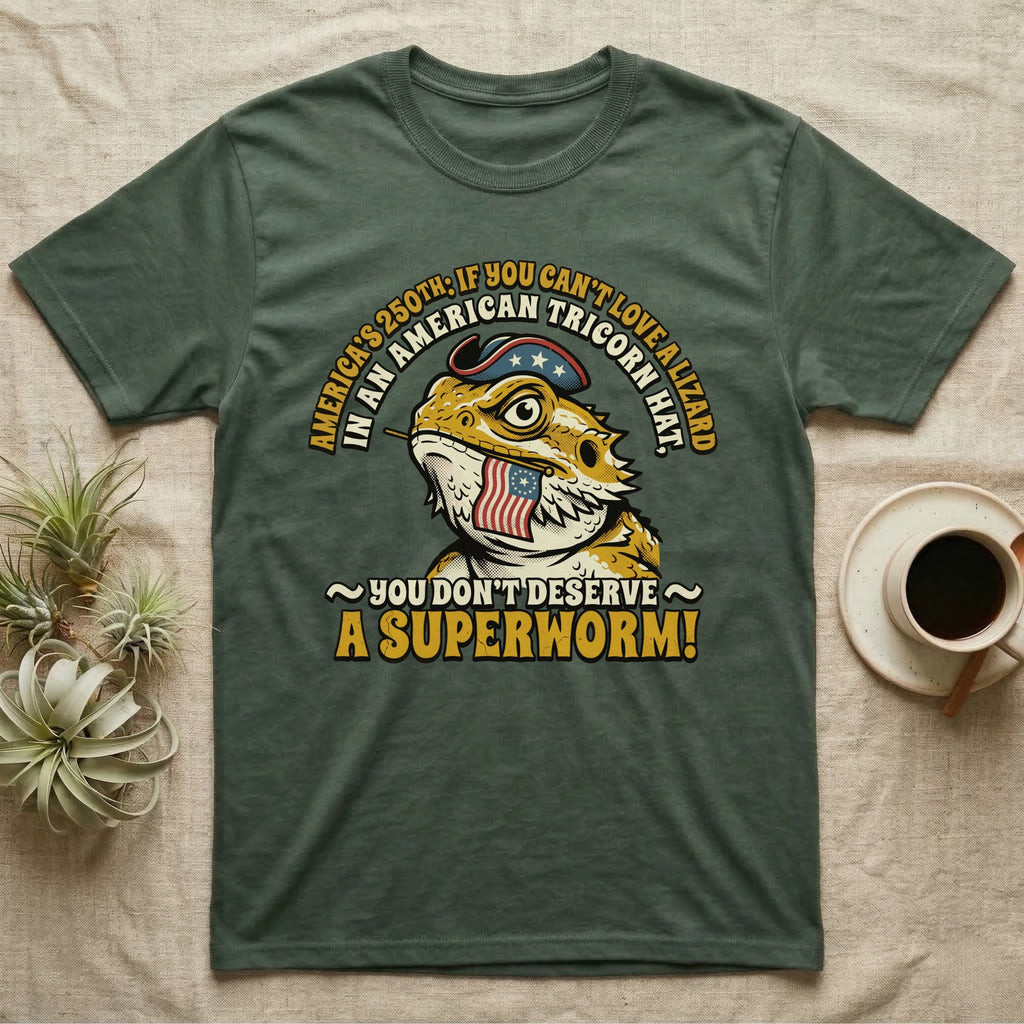 Bearded Dragon Tricorn Tee in Military Green — Bold woodcut tee of a bearded dragon in a colonial tricorn hat, gold and cream text reading You Don't Deserve A Superworm, on black.