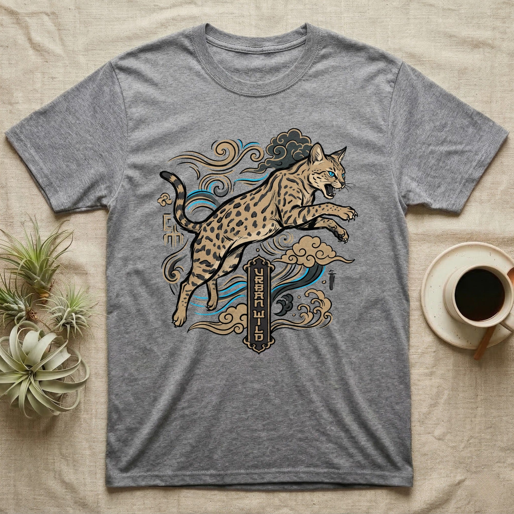 Grey t-shirt with a jumping spotted wild cat and Asian-inspired cloud design.
