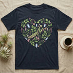 Dark t-shirt with a heart design featuring a praying mantis, leaves, and crystals.