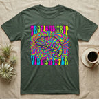 Green t-shirt with psychedelic chameleon graphic and text "TROPICAL TRIP VIBE SHIFTER".