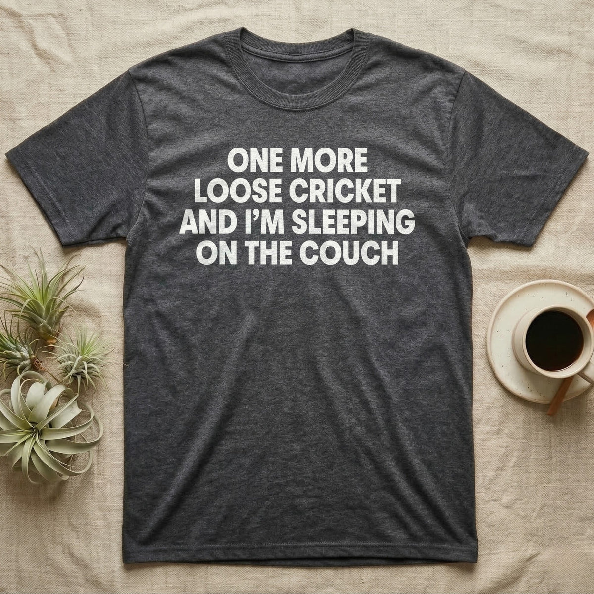 Reptile Loose Cricket T-Shirt in Dark Heather — Bold white capital letters stacked in four lines reading ONE MORE LOOSE CRICKET AND I'M SLEEPING ON THE COUCH