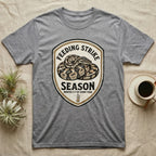 Ball Python Feeding Strike T-Shirt in Sport Grey — Vintage-ink badge of a coiled ball python with carved type "Feeding Strike Season" and fine print "Months 3-7 Of Every Year."
