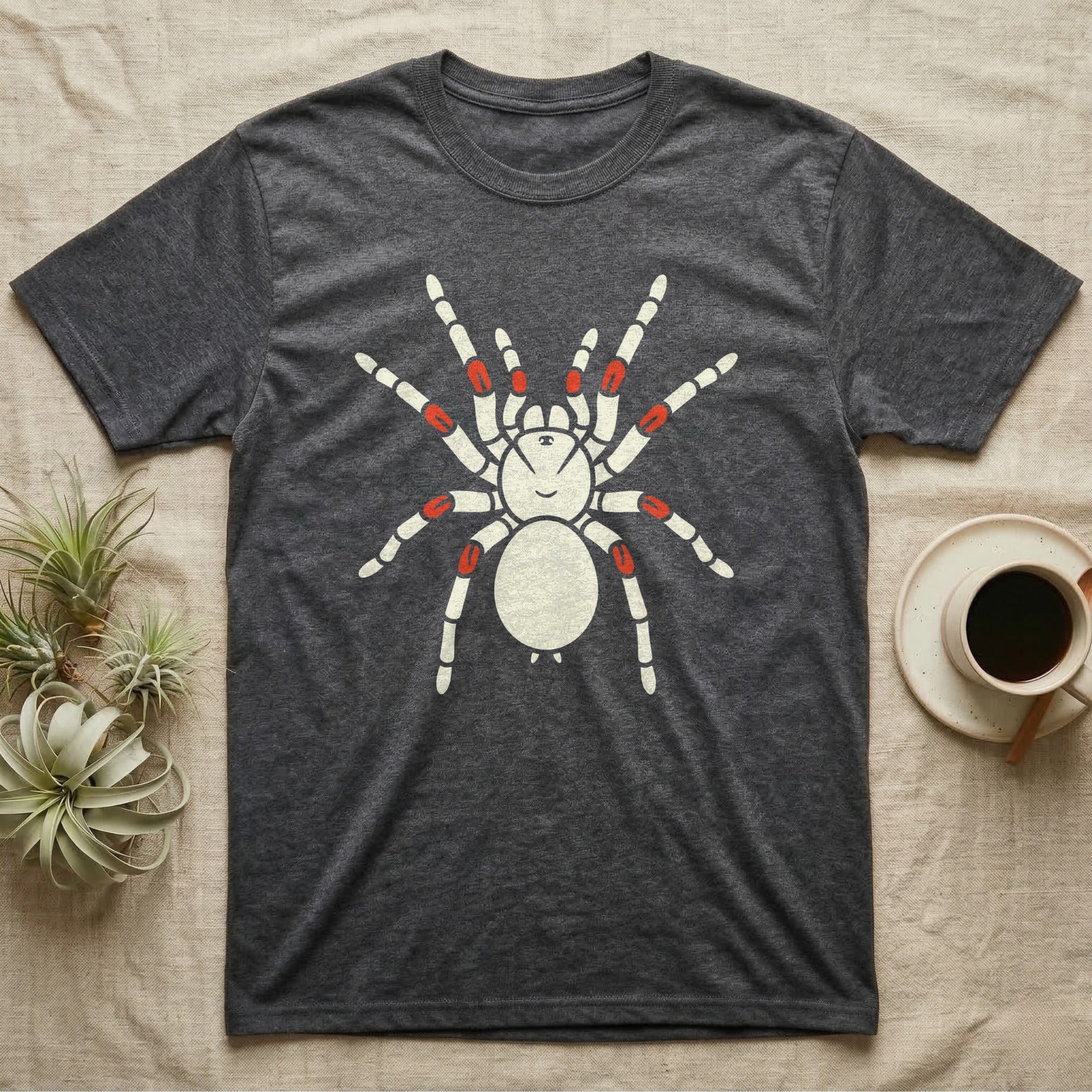 Dark grey t-shirt with a white spider graphic and red-tipped legs.