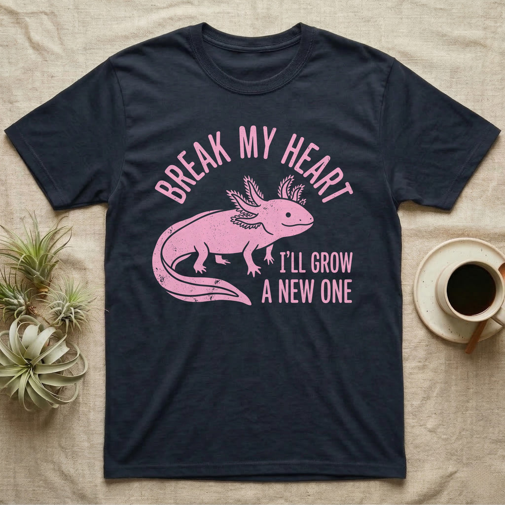 Axolotl Regrow T-Shirt in Navy — Worn one-ink pink axolotl walking side-on, gills spread, under Break My Heart, I'll Grow a New One