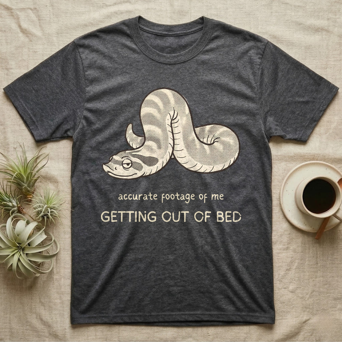 Hognose Morning Mood T-Shirt in Dark Heather — Retro-illustration of a hognose snake flopped limp with hand-drawn marker text about getting out of bed.