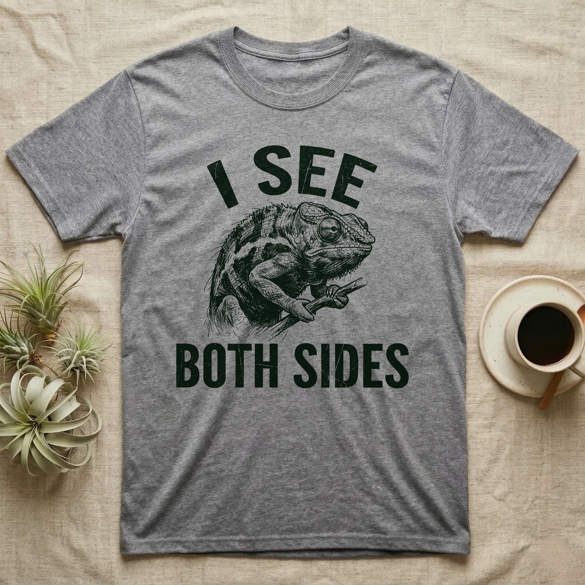 Panther Chameleon Mediator T-Shirt in Sport Grey — Etching of a panther chameleon holding a twig, its eyes pointing opposite ways, under I SEE, above BOTH SIDES