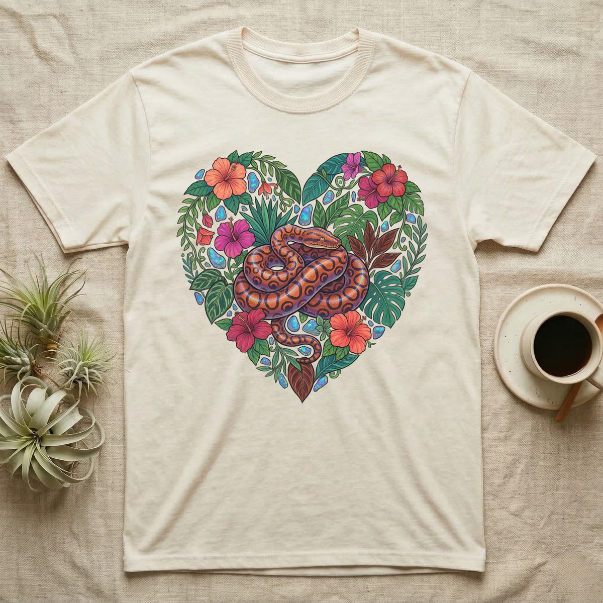 Cream t-shirt with heart-shaped floral and snake design.