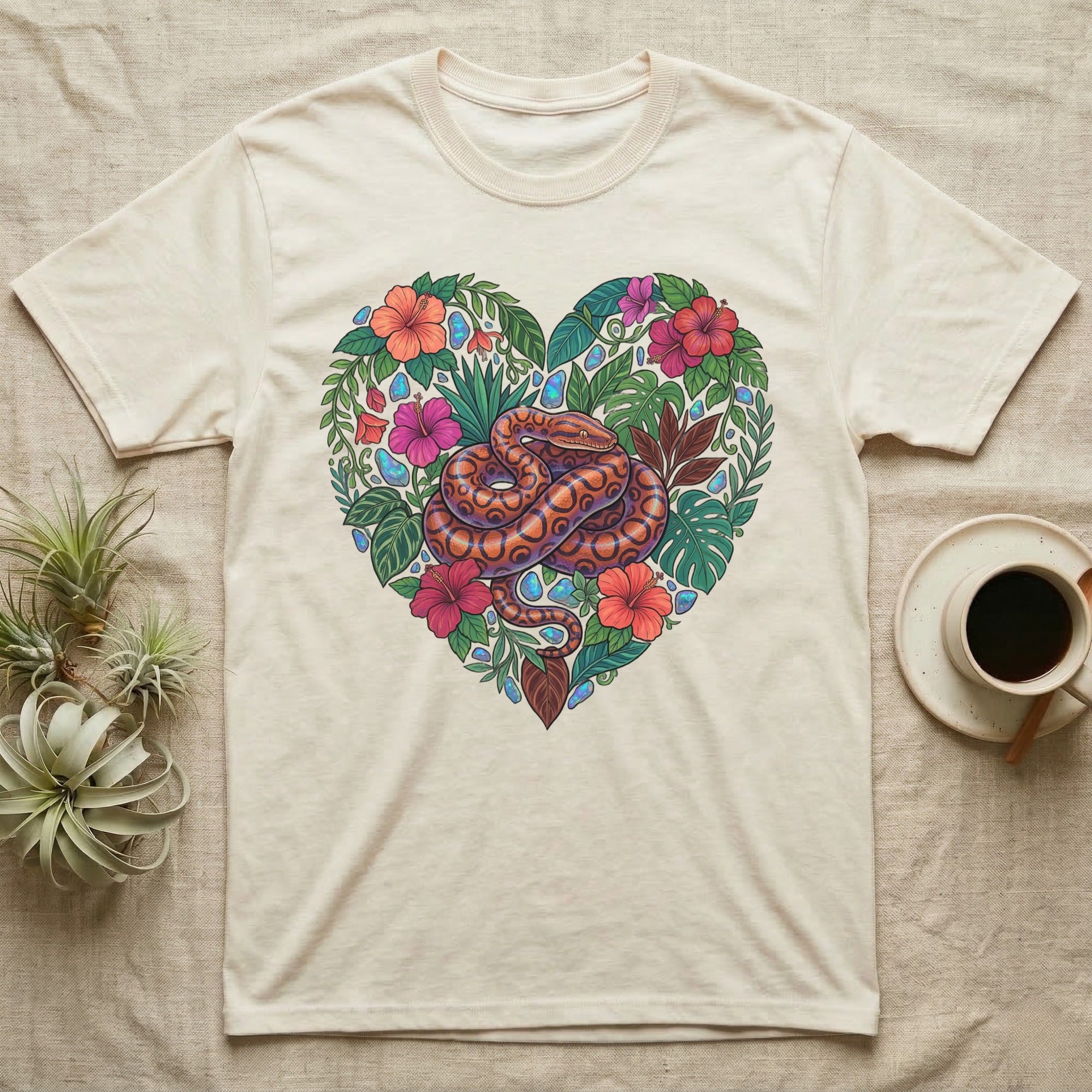 Cream t-shirt with heart-shaped floral and snake design.