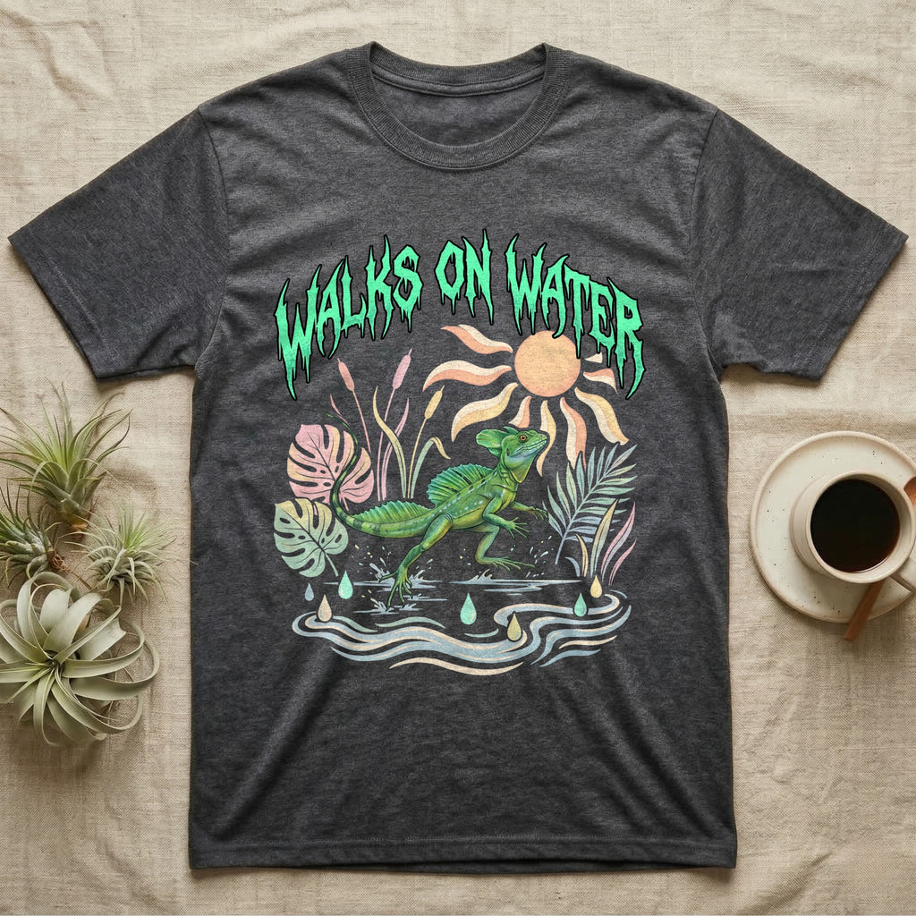 Green Basilisk Feral T-Shirt in Dark Heather — Green plumed basilisk sprinting across water below a dripping aqua-green metal "Walks On Water" wordmark