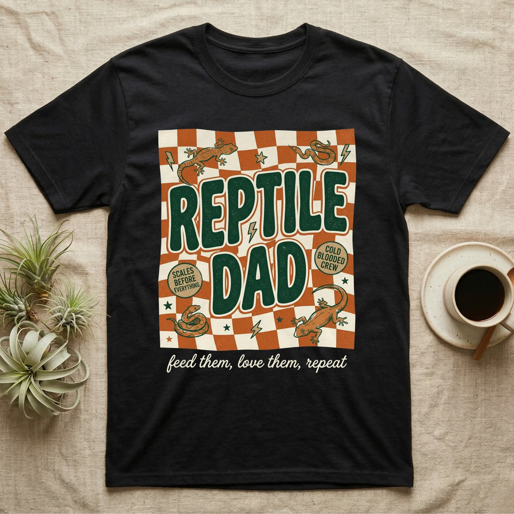 Black t-shirt with "REPTILE DAD" text, checkered pattern, and gecko graphics.