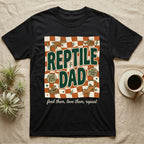 Black t-shirt with "REPTILE DAD" text, checkered pattern, and gecko graphics.