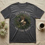 Crested Gecko Care Sheet T-Shirt in Dark Heather — Botanical wreath of pothos and moss circling a crested gecko, closed by two arcs of Roman capitals.