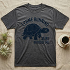Red-Foot Tortoise Running T-Shirt in Dark Heather — Navy silhouette of a red-footed tortoise walking under arched words I Come Running, beside Start Without Me