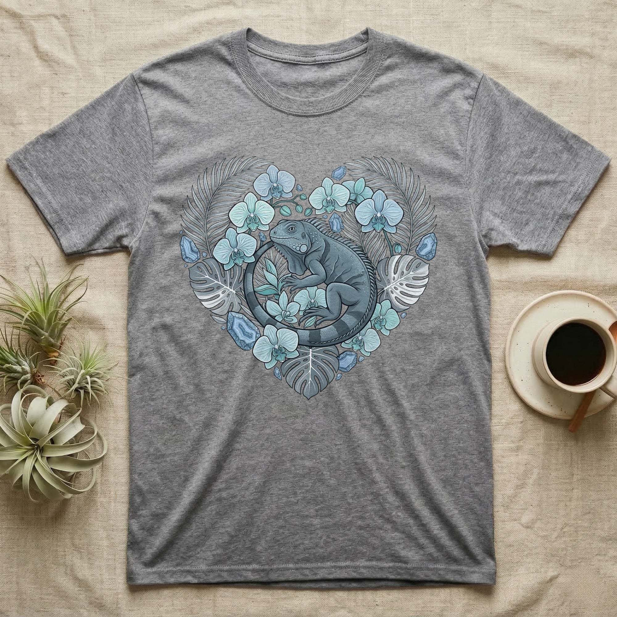Grey t-shirt with heart-shaped floral iguana graphic.