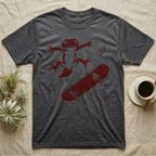 Knob-Tailed Gecko Kickflip T-Shirt in Dark Heather — Distressed one-ink illustration of a knob-tailed gecko airborne mid-kickflip above a tumbling skateboard.