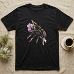 Pink-Toe Tarantula Blossom T-Shirt in Black — Watercolor illustration of a charcoal pink-toe tarantula with salmon toe tips holding an orchid blossom sprig, on a dark grey t-shirt.