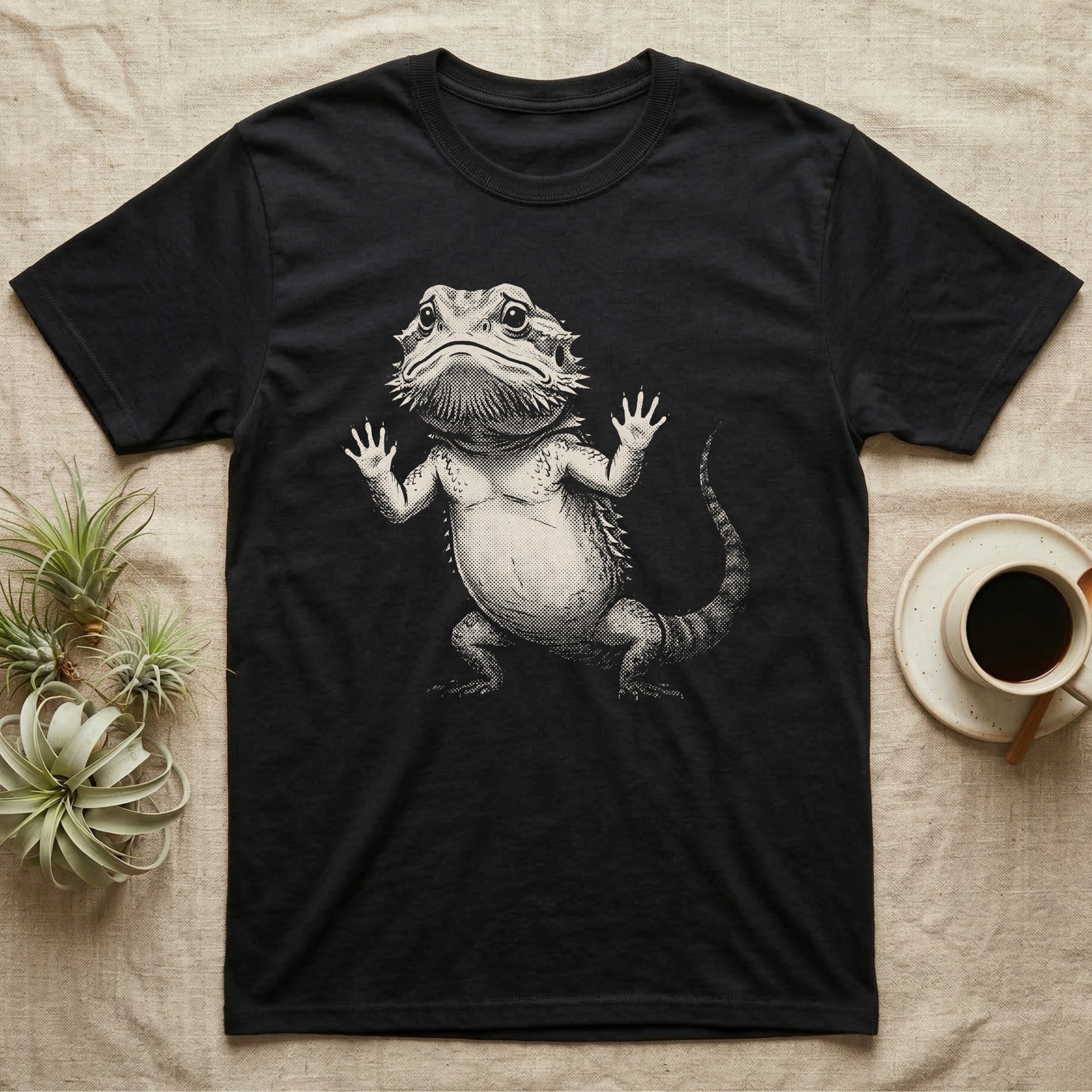 Begging Bearded Dragon T-Shirt in Black — Sad-meme halftone illustration of a bearded dragon standing upright with arms pressed to unseen glass, looking forlorn.