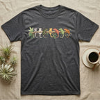 Crested Gecko Canopy Crew T-Shirt in Dark Heather — Watercolor illustration of seven crested gecko colour morphs perched on a branch, dark grey T-shirt design.