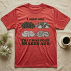 Ball Python Collector T-Shirt in Heather Red — Four engraved ball python morphs in tight coils between the words I said one and THAT WAS FOUR SNAKES AGO.