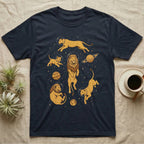 Lions in astronaut helmets float among planets and stars on a navy blue t-shirt.
