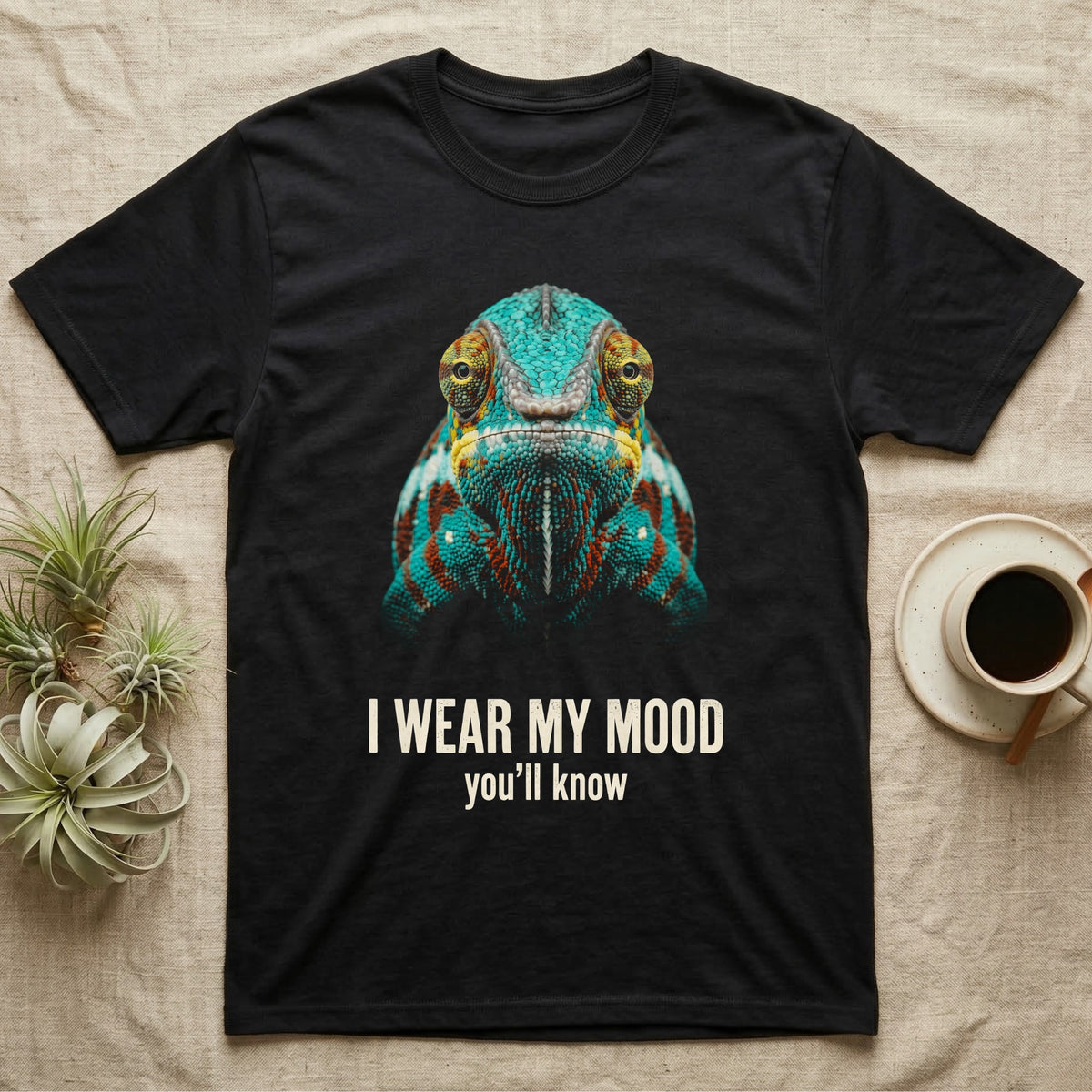 Flat-black mug-shot portrait of a turquoise and rust panther chameleon staring at the camera, with the printed words I Wear My Mood, you'll know. — shown on a Black tee.