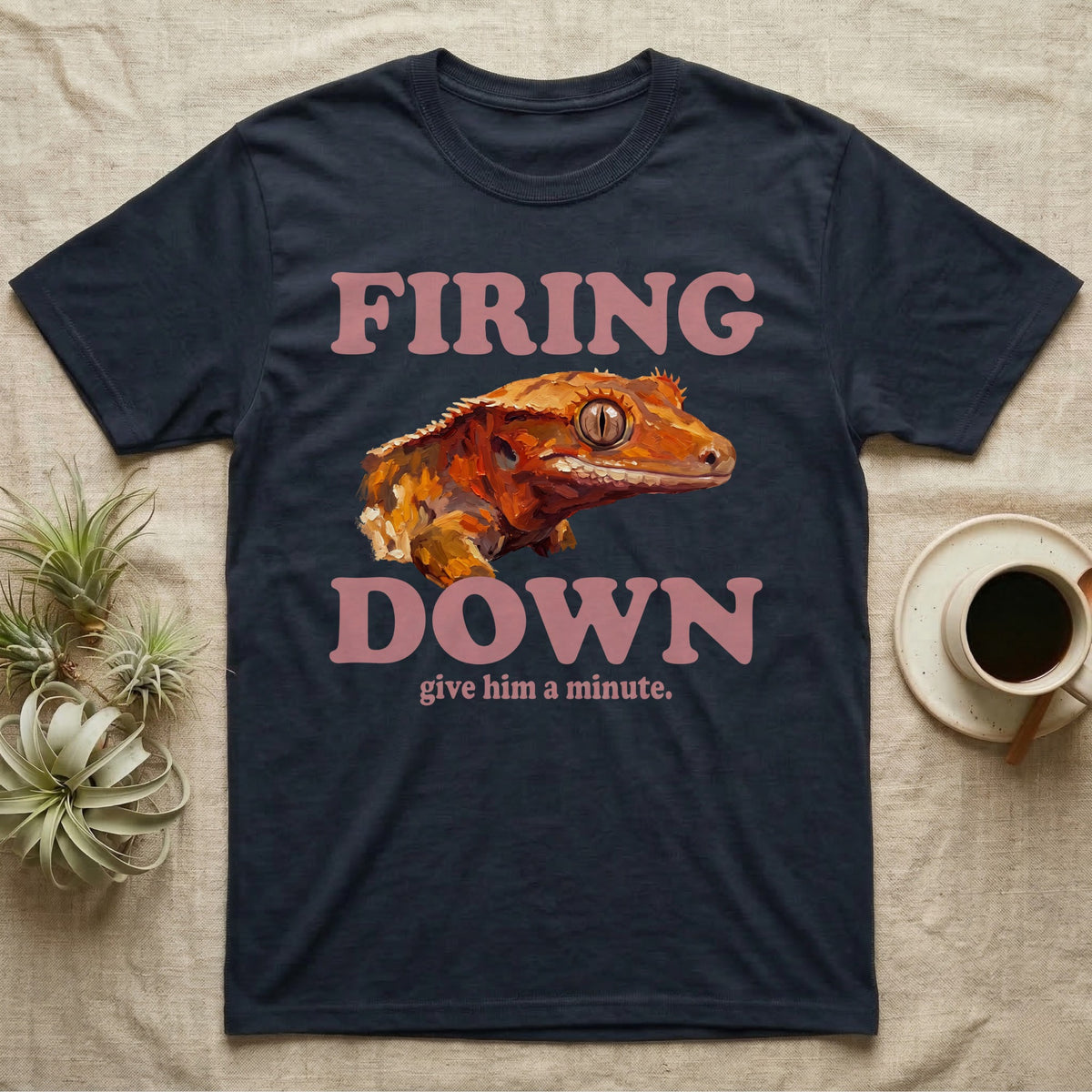 Crested Gecko Firing Down T-Shirt in Navy — Engraved crested gecko in navy ink between the rose words Firing and Down, with give him a minute above.