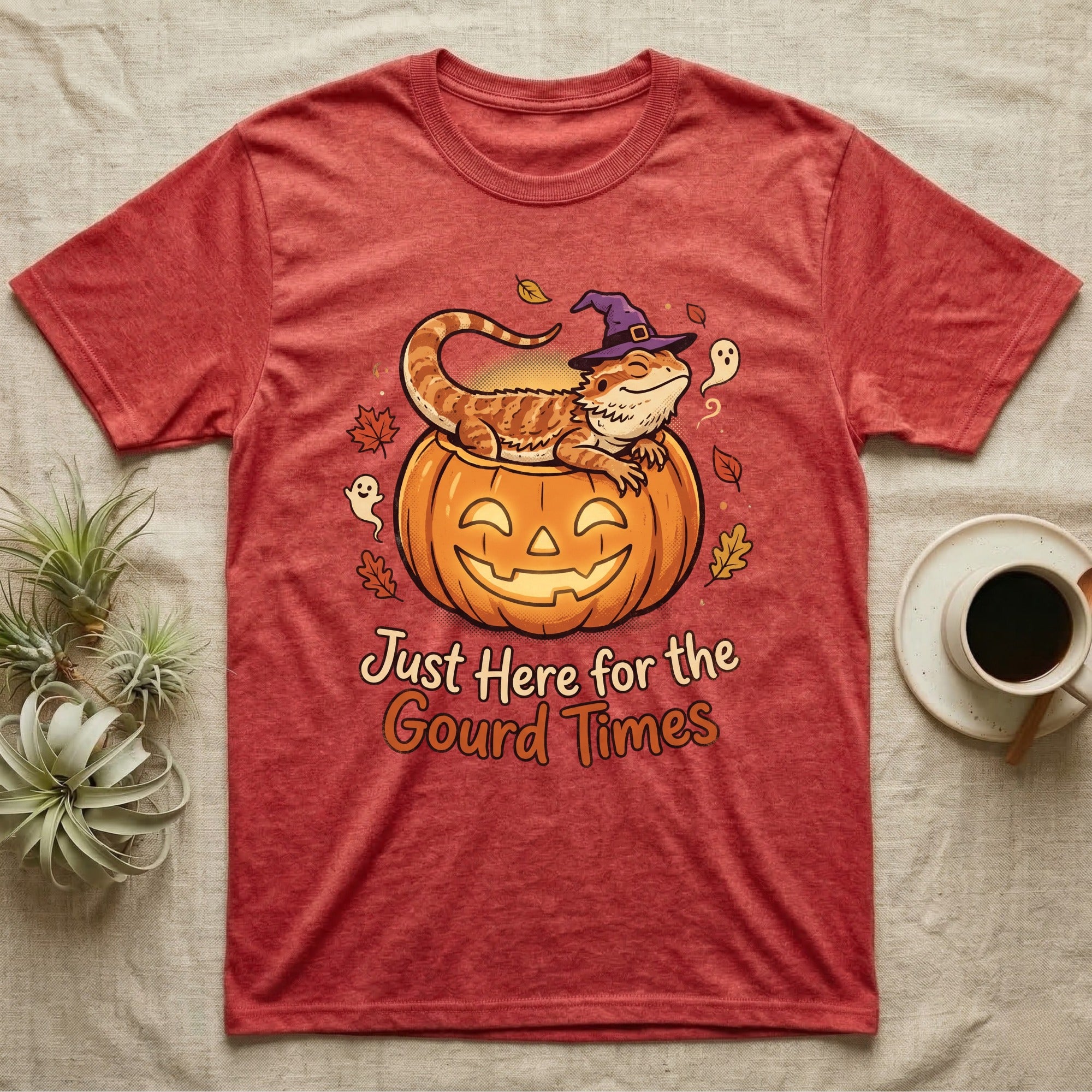 Bearded Dragon Gourd Times T-Shirt in Heather Red — Cartoon bearded dragon in a witch hat lounging in a jack-o'-lantern, "Just Here for the Gourd Times."