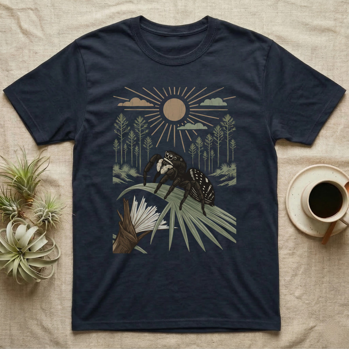 Jumping Spider Home Range T-Shirt in Navy — Woodcut-style illustration of a regal jumping spider perched on a saw palmetto blade with pines behind, no on-shirt text.