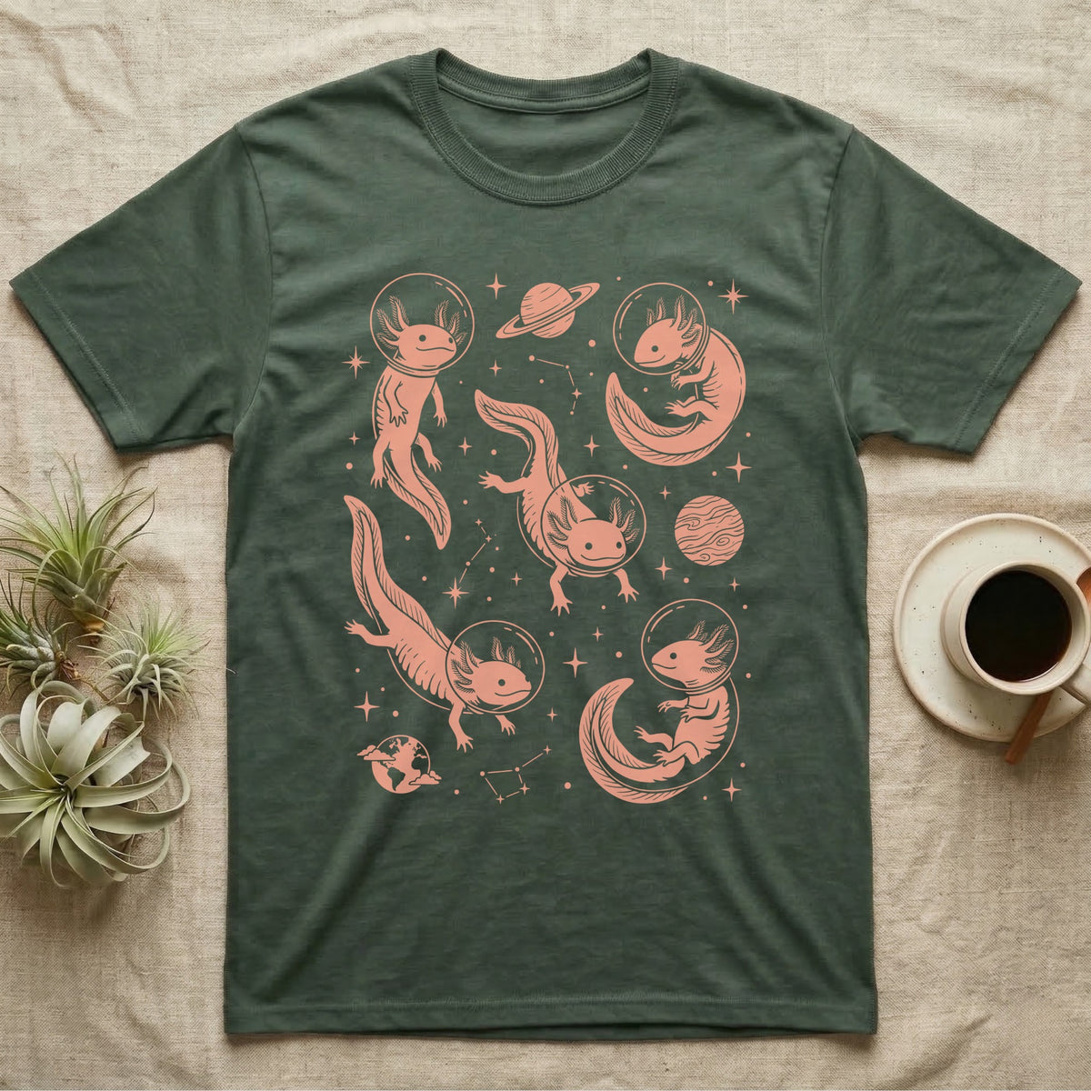 Axolotl Cosmic T-Shirt in Military Green — Vintage screen-print illustration of axolotls in astronaut helmets floating in space, soft coral monochromatic on dark background.