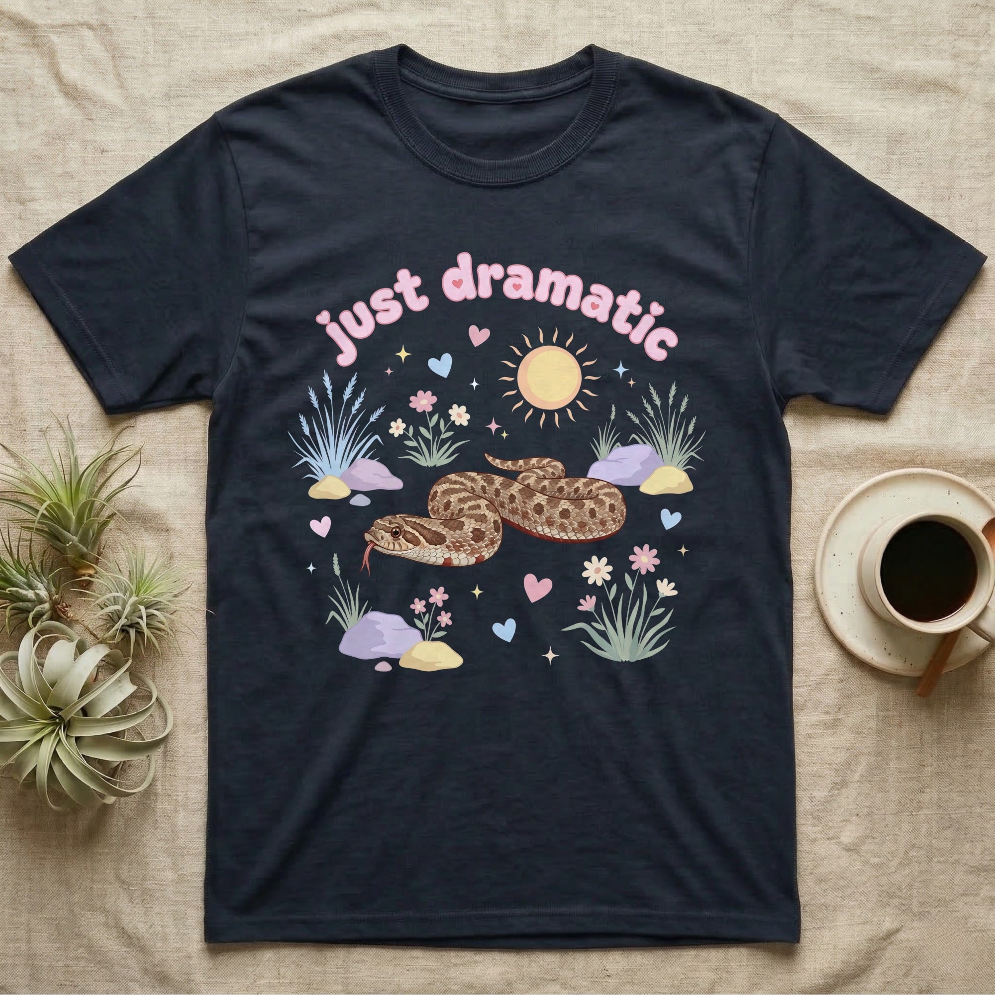 Western Hognose Snake Baby T-Shirt in Navy — Pastel western hognose snake in a low coil with tongue out among grasses, puffy pink bubble wordmark "just dramatic" above.