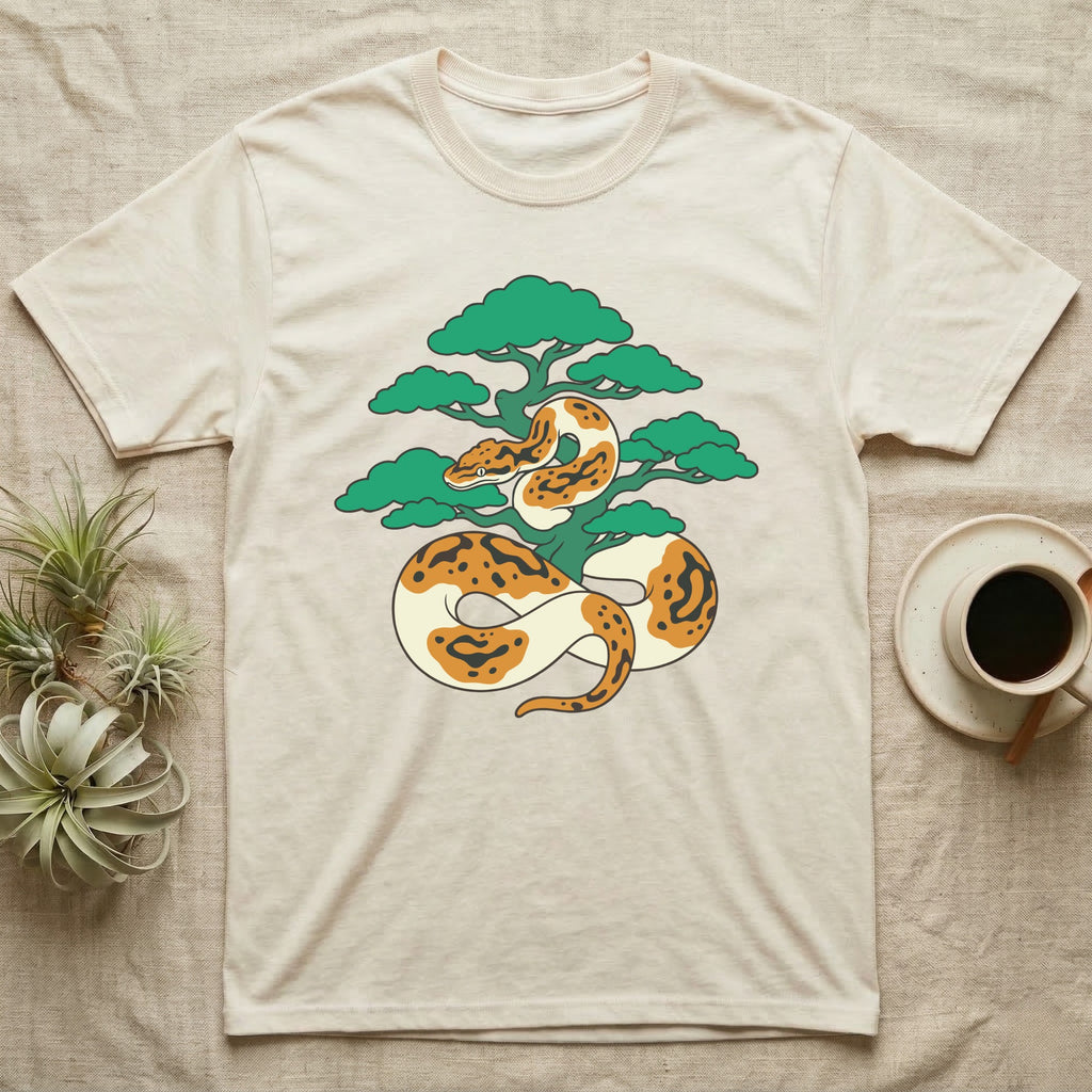 Ball python wrapped around a stylized tree on a cream t-shirt.