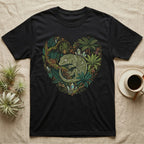 Black t-shirt with heart-shaped design featuring a green gecko surrounded by tropical foliage and crystals.