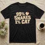 99% Snakes Keeper T-Shirt in Black — Distressed-block wordmark reading 99 percent snakes 1 percent cat with a small pie-chart accent glyph.
