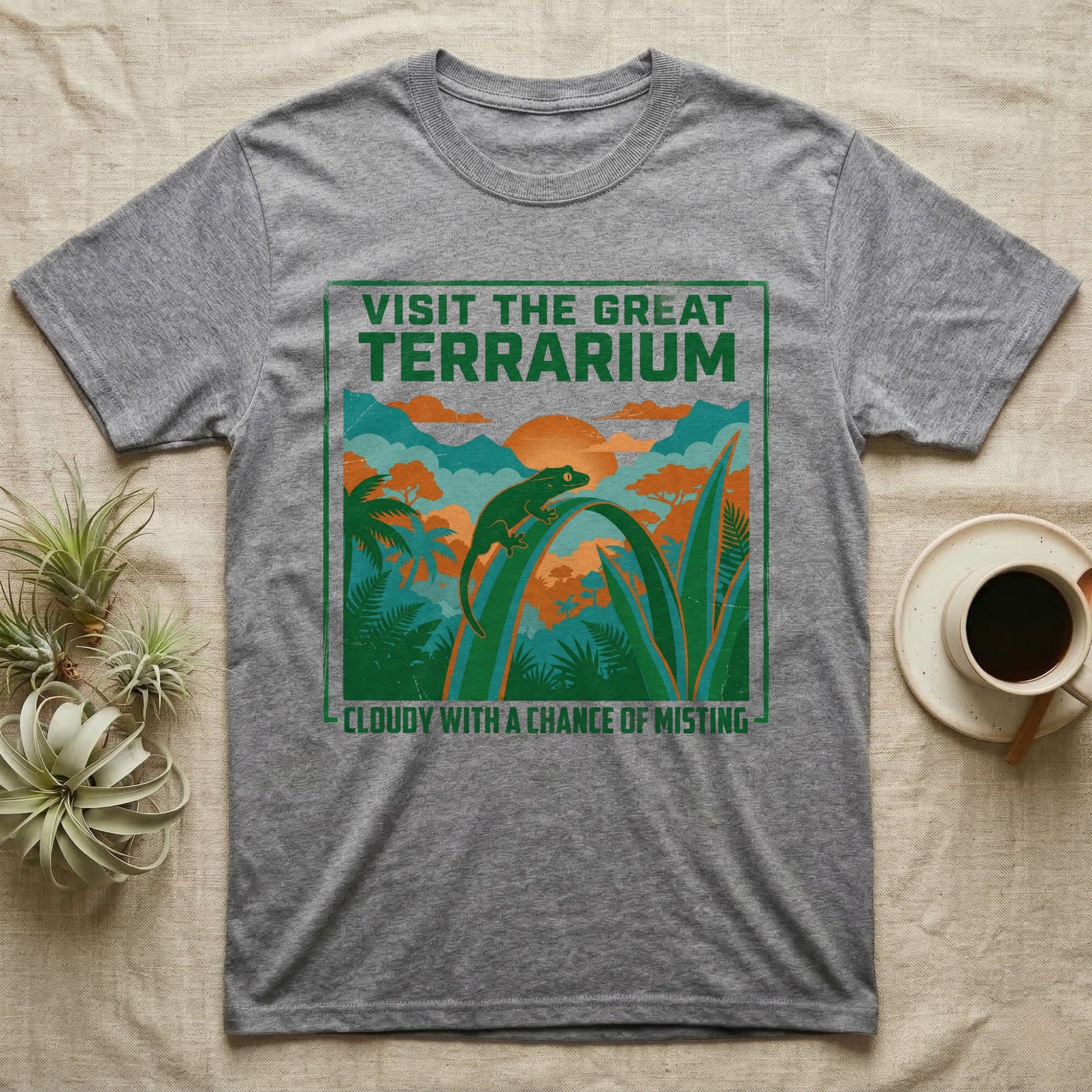 Gray t-shirt with "Visit the Great Terrarium" and a misty jungle scene.