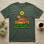 Green t-shirt with pixelated lizard, sun, and "Level Up: Bug Hunter" text.