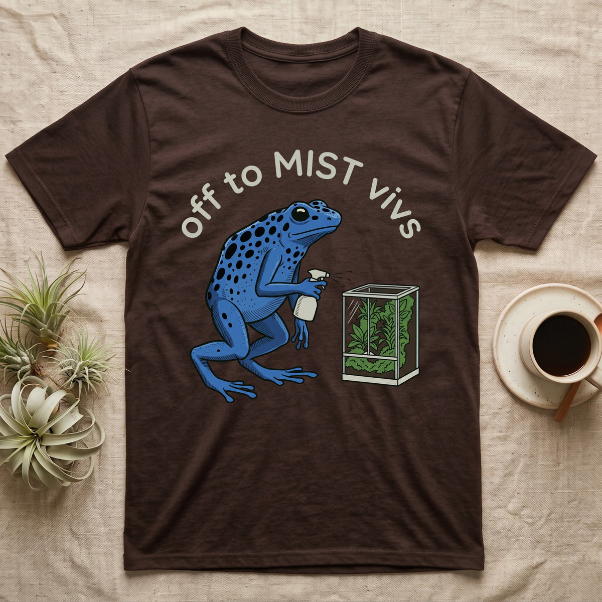 Dart Frog Misting T-Shirt in Dark Chocolate — Spotted blue dart frog spraying a planted vivarium under the words off to MIST vivs