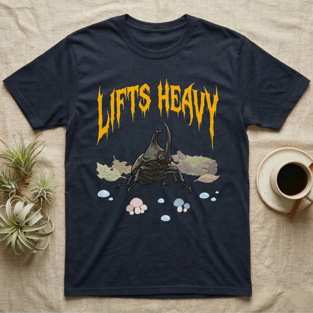 Rhino Beetle Feral T-Shirt in Navy — Horned rhinoceros beetle standing head-on below a dripping amber-gold metal "Lifts Heavy" wordmark