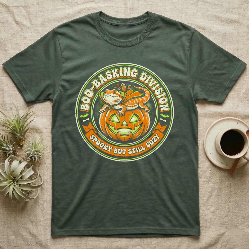 Bearded Dragon Boo-Basking T-Shirt in Military Green — Retro badge of a caped bearded dragon on a green-glowing pumpkin, "Boo-Basking Division, Spooky But Still Cozy."