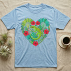Light blue t-shirt with a green gecko and tropical plants in a heart shape.