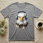 Bald eagle wearing headphones, front view, on a grey t-shirt.